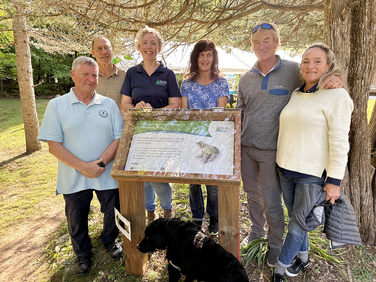 Supporters unveil the trailhead of Foley Mountain's new story trail